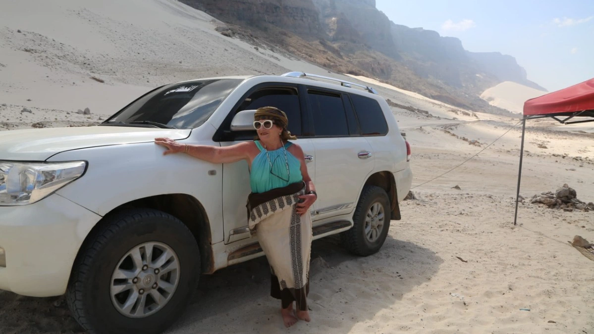 Travelers exploring Socotra by local vehicle during an organized island tour
