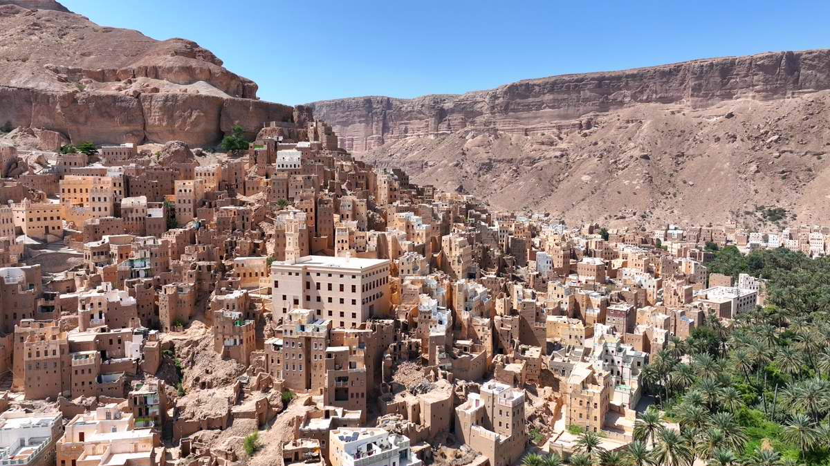 Budah village, palm groves and canyon cliffs in Wadi Doan, Yemen